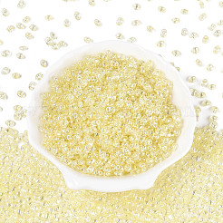 透明色光沢ガラスシードビーズ  オーバル  2穴  淡黄色  3~4.5x5~6x2.5~3mm  穴：1~1.2mm  約6080個/ポンド&nbsp;SEED-N008-09F