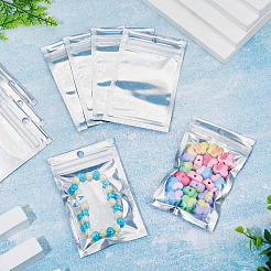 キラキラ輝くホログラフィックスター柄のプラスチック製包装袋（陰陽柄）、再封可能。60個入り。  トップセルフシールパウチ  長方形  銀  12x7.5x0.01cm  片側の厚さ：2.5ミル（0.065mm）&nbsp;OPP-TA0001-24A