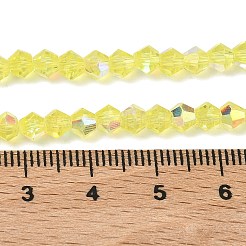 電気メッキ透明ガラスビーズ連売り  双円錐形  ABカラーメッキ  多面カット  半分メッキ  きいろ  4.5x3.5~4mm  穴：0.8~1mm  約82~83個/連  12.01''~12.20''（30.5~31cm）。&nbsp;EGLA-K015-18F
